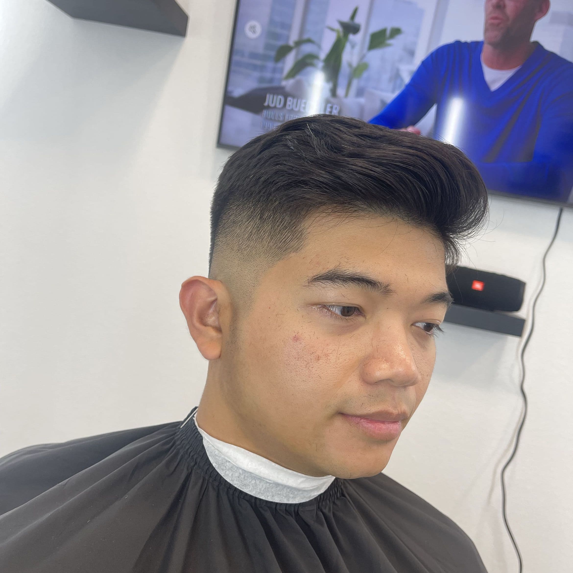 A finished cut in the NV Studio chair, mid fade with volume on top